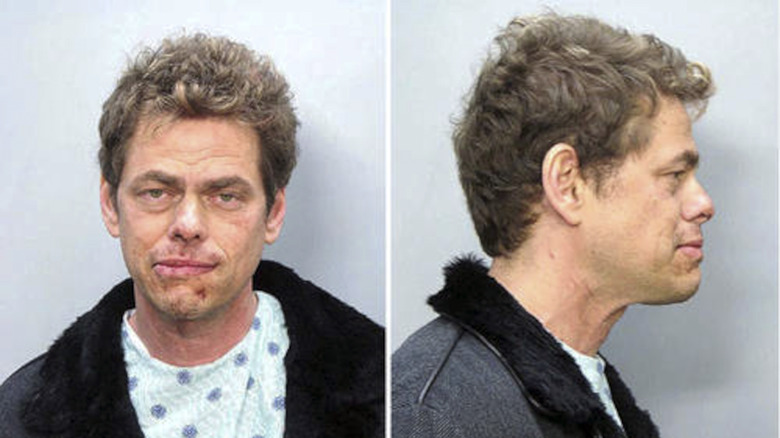 Vince Offer looking beaten up in a mug shot