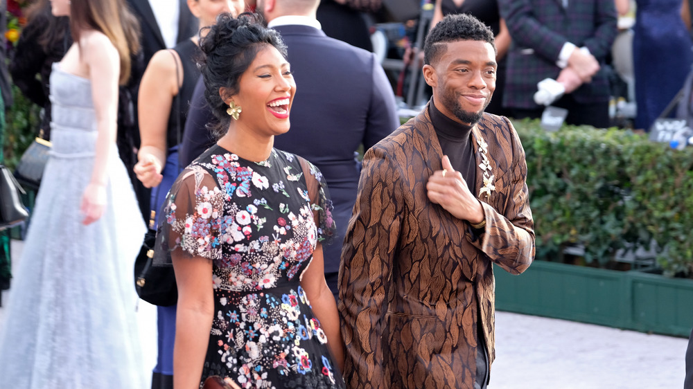 Chadwick Boseman walking with his wife