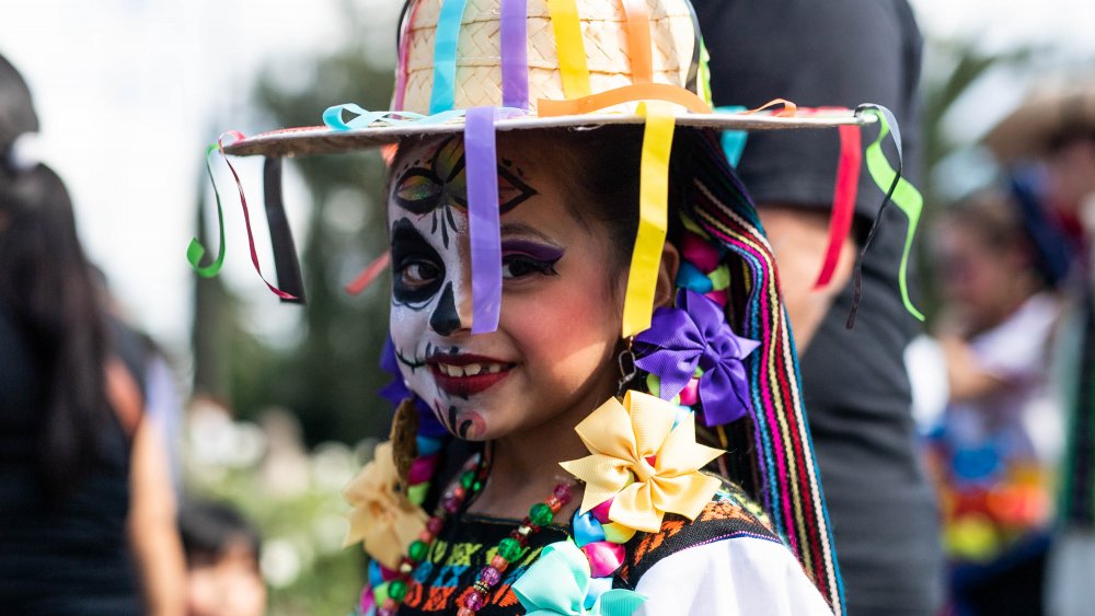 Girl dressed up for Dia de los Muertos