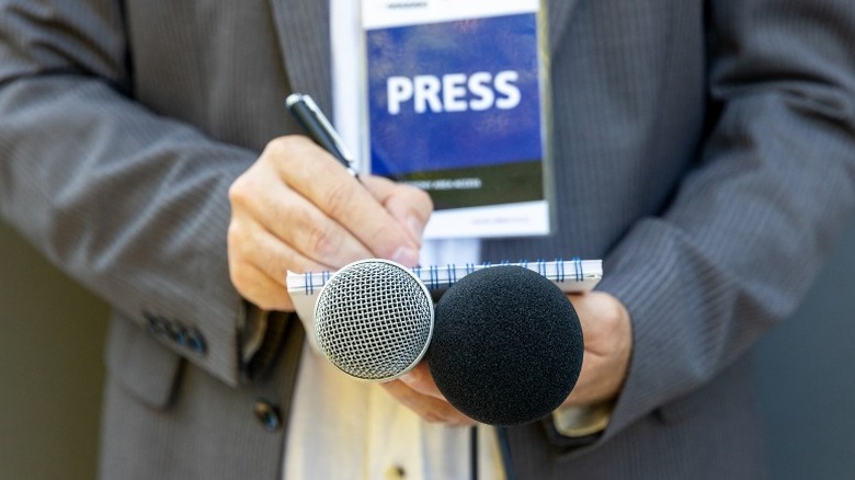 male journalist with microphone