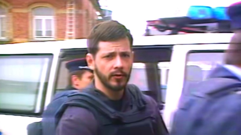 Marc Dutroux near police car