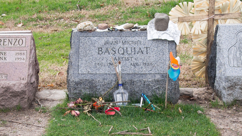 Jean-Michel Basquiat's gravesite with paintbrushes