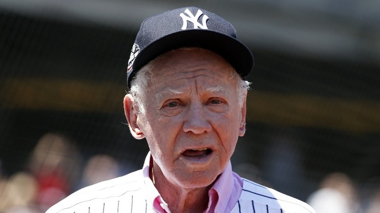 Whitey Ford wearing hat