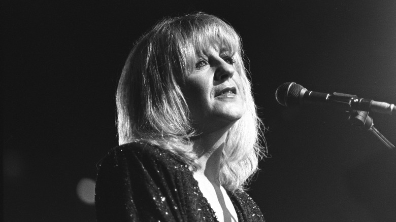 Christine McVie onstage sitting at piano