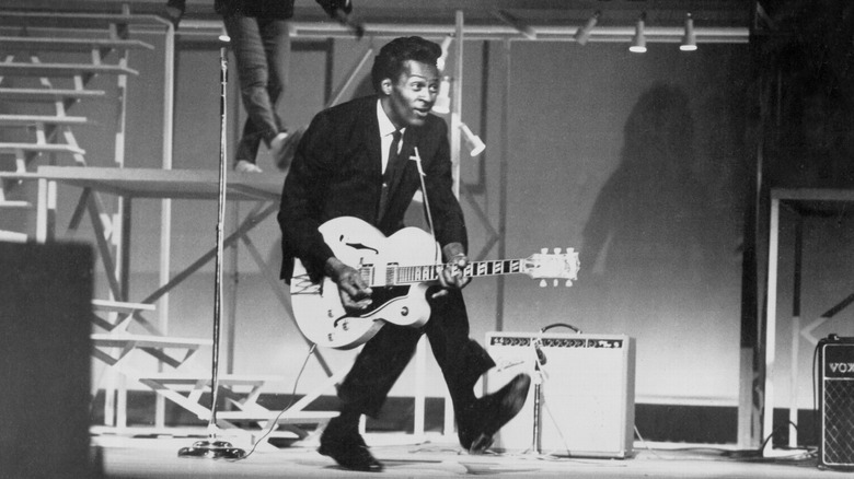 Chuck Berry playing guitar onstage