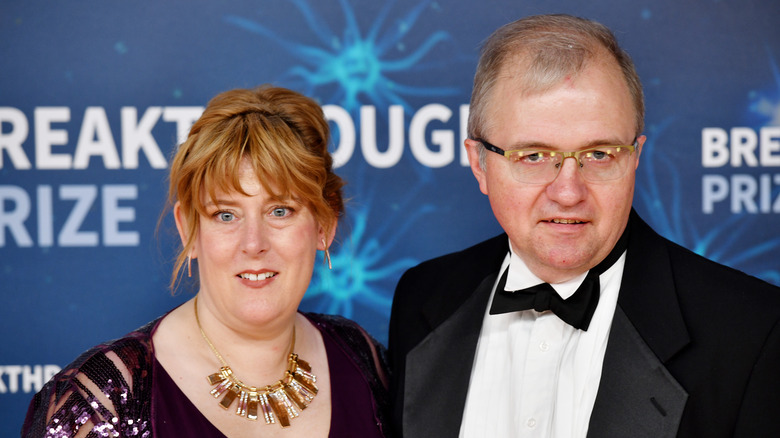 Robert Hawking with wife in black tie