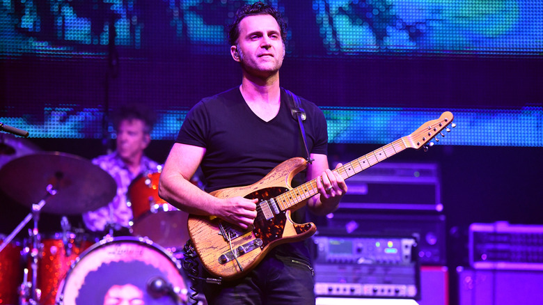 Dweezil Zappa playing guitar