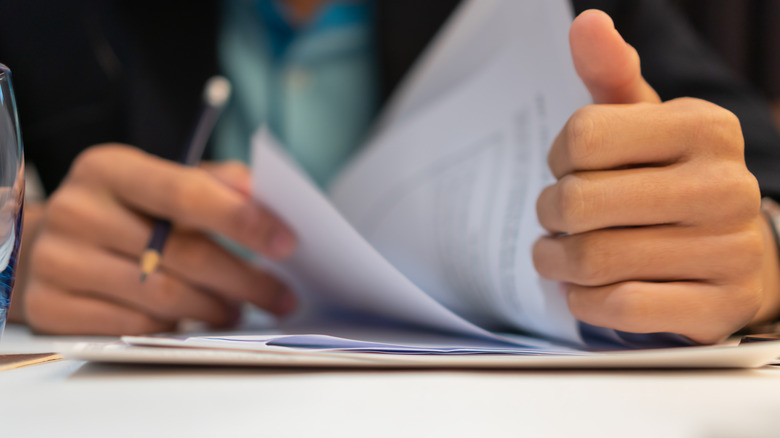 man reading paperwork