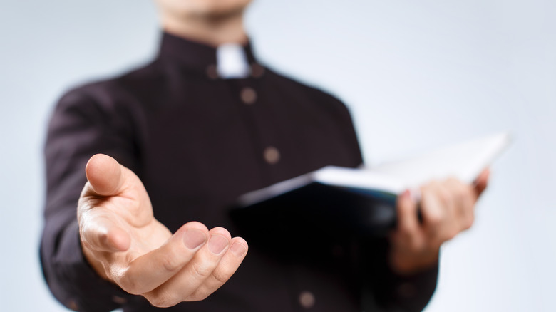 Priest with Bible