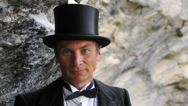 An actor dressed as Professor Moriarty poses by the Reichenbach Falls