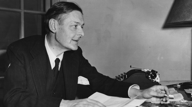 T. S. Eliot works at his desk