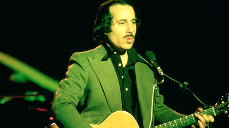 Paul Simon performing onstage