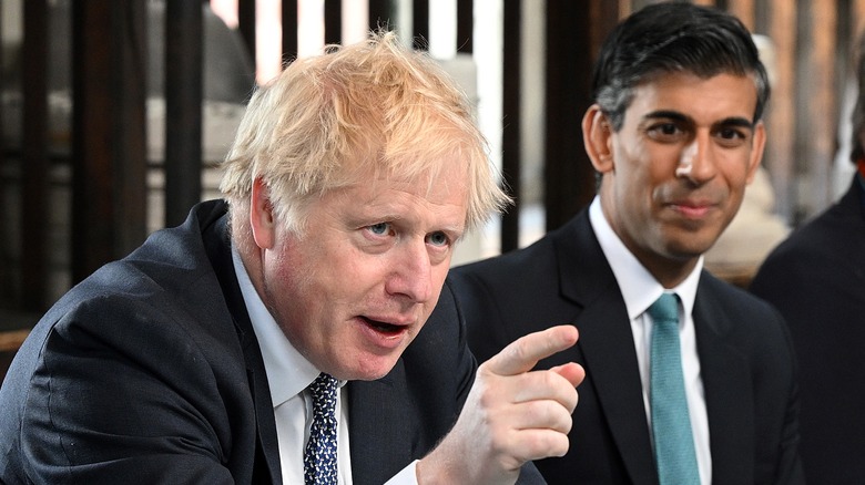 Boris Johnson and Rishi Sunak sit together