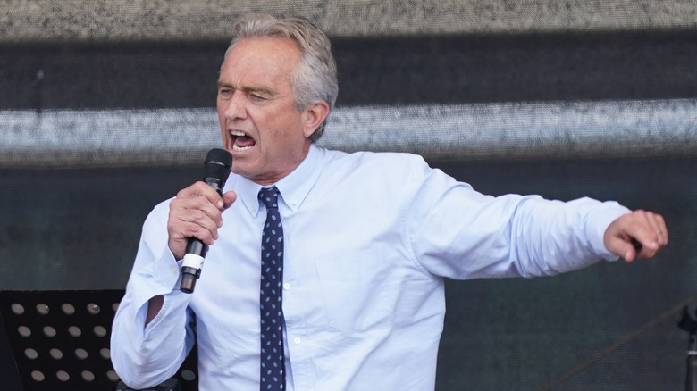 Robert Kennedy Jr. pointing while speaking angrily into a microphone