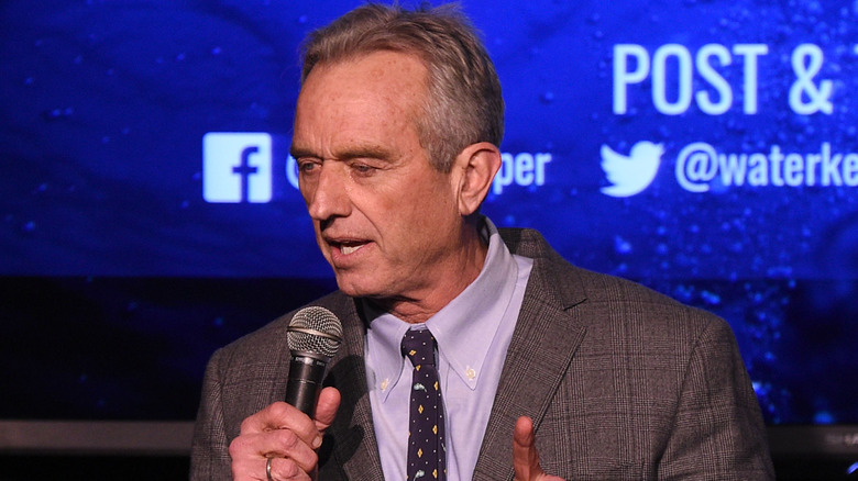 Robert Kennedy Jr. speaking into microphone onstage