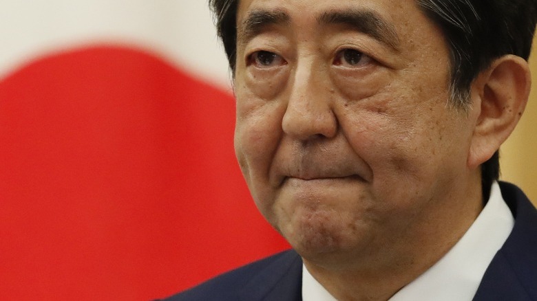 tight-lipped Shinzo Abe