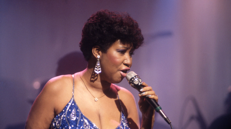 Aretha Franklin holding microphone