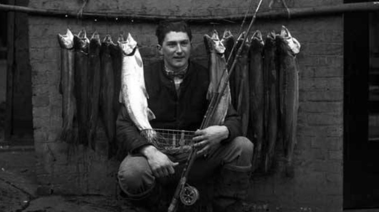 Eddie Bauer with trout, 1926