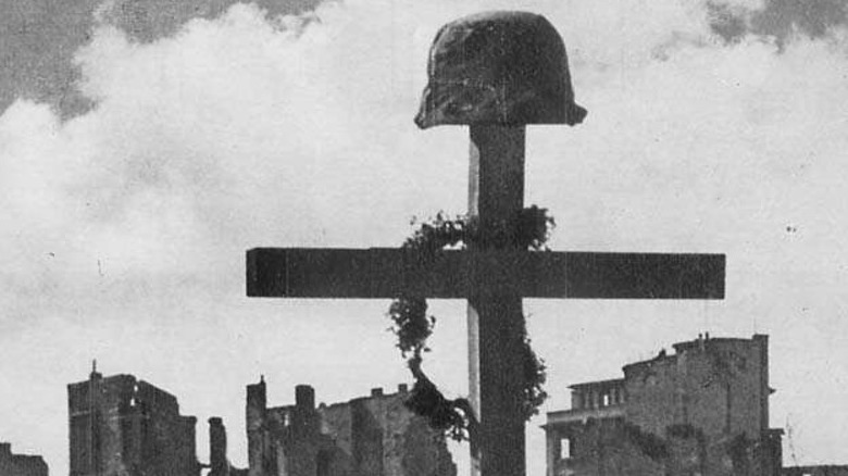 cross on helmet over grave