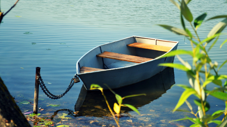 wooden rowboat on the river