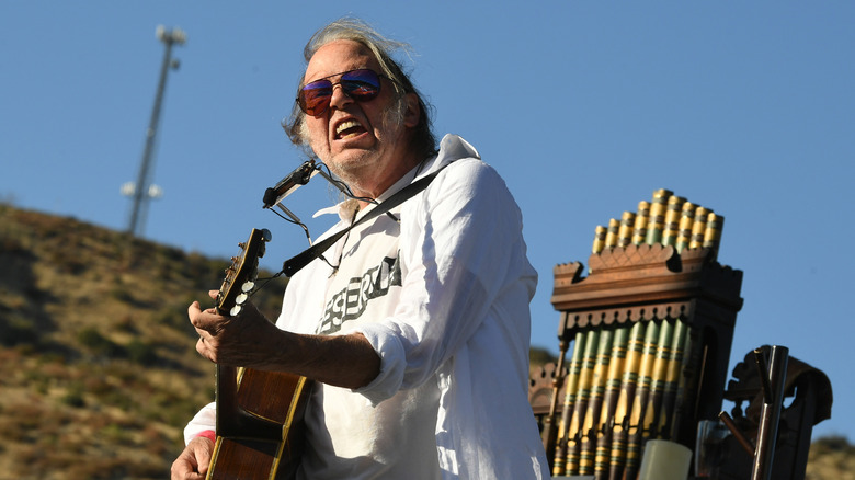 Neil Young playing guitar