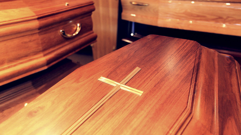 wooden caskets adorned with cross