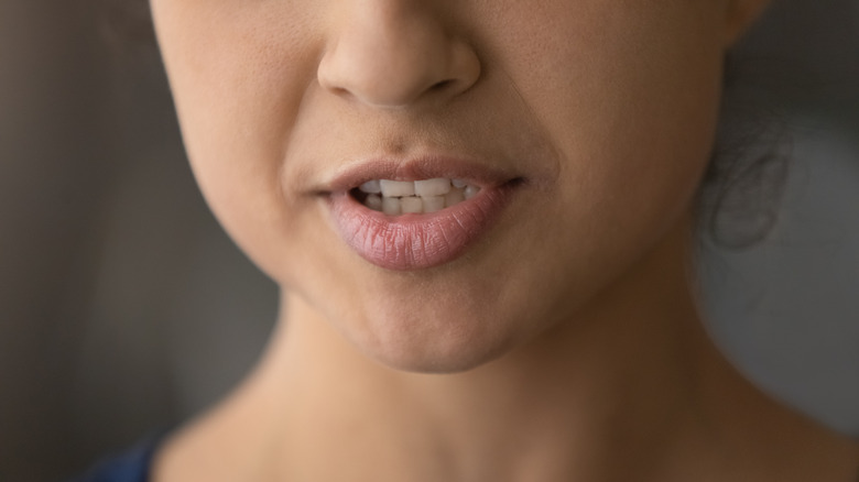 Woman forming sound with lips