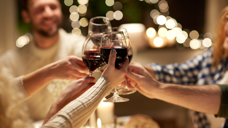 hands holding glasses of wine