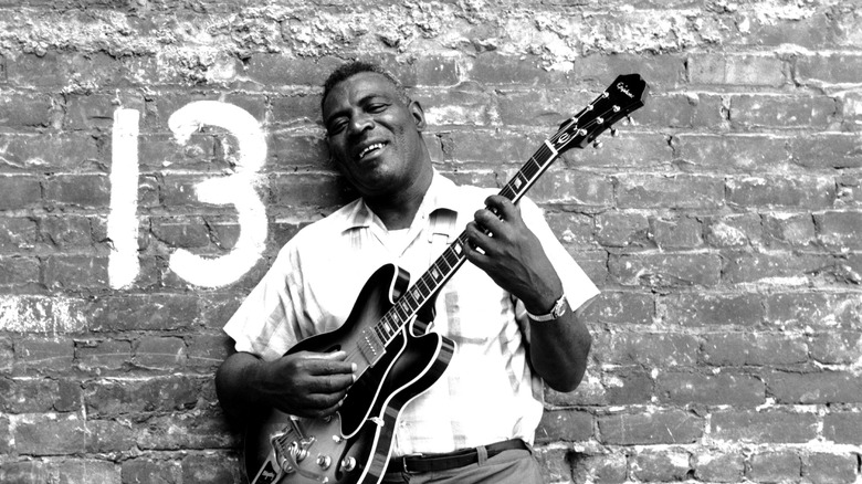 Howlin' Wolf holding guitar