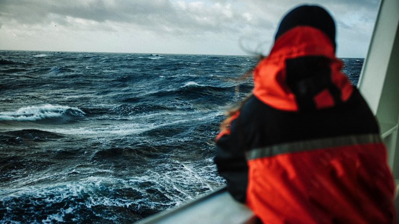 Fisherman looking at a storm moving in 