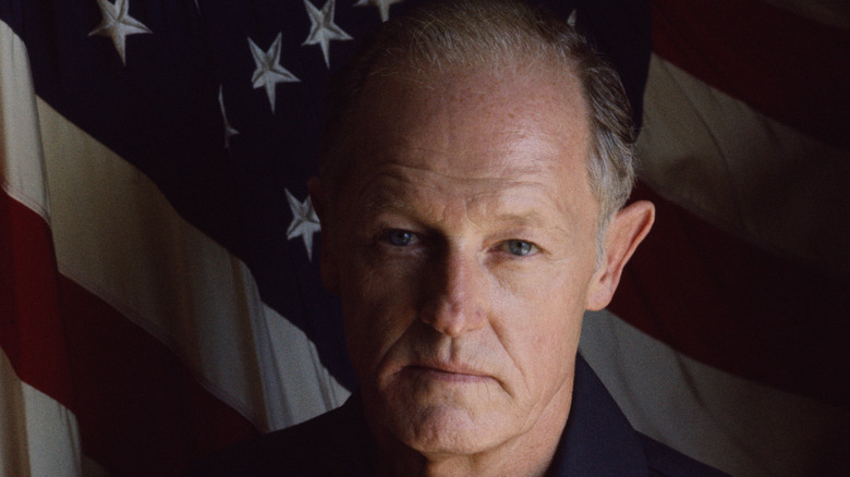 E. Howard Hunt with American flag in background