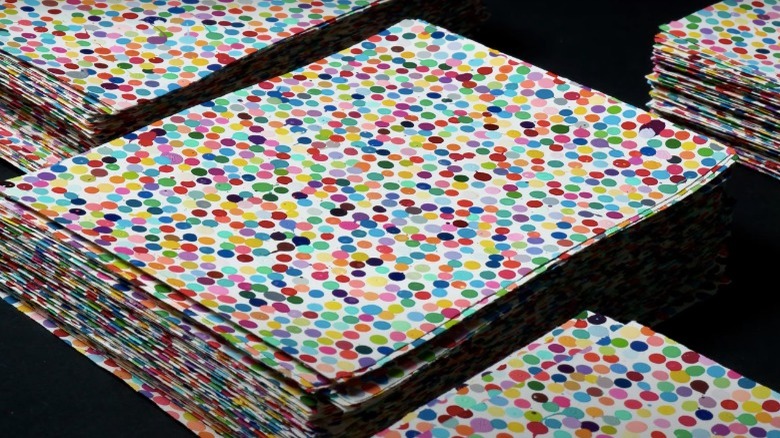 Stacks of dot paintings from Damien Hirst's The Currency