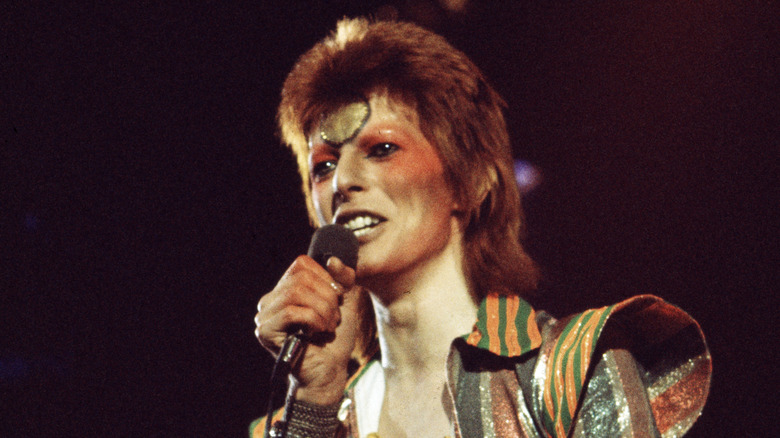 David Bowie performing on stage as Ziggy Stardust