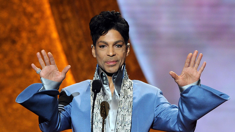 Prince holding up his hands, 2011