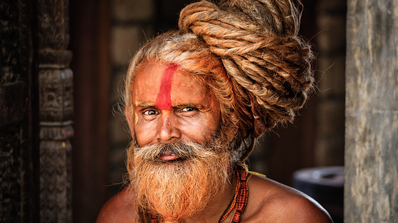 Sadhu holy man with dreadlocks smiling