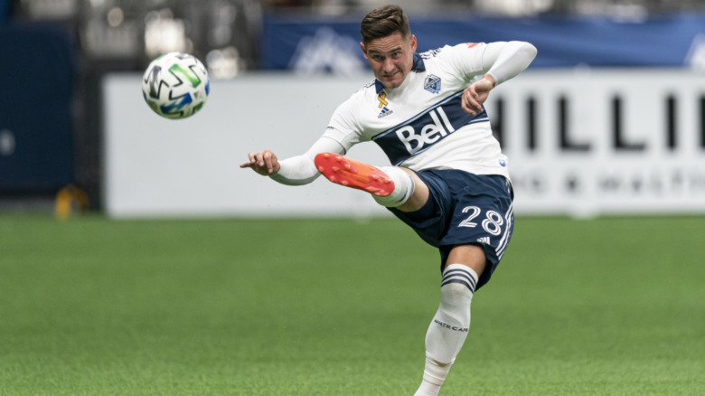 Vancouver player kicks the ball