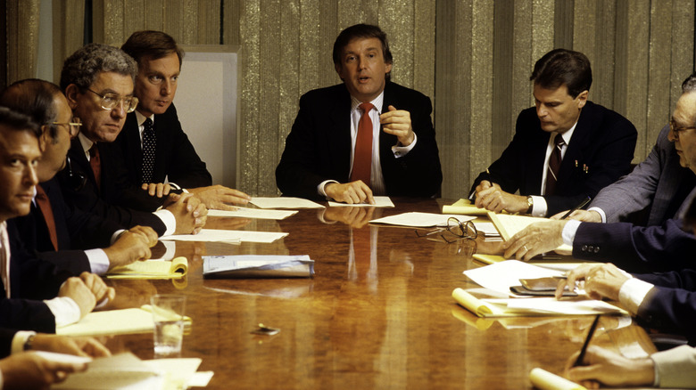 Donald Trump heads a board meeting