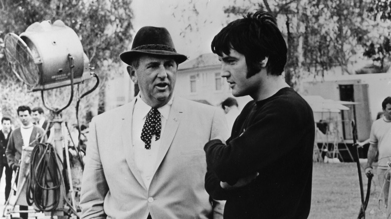 Tom Parker and Elvis Presley on film set