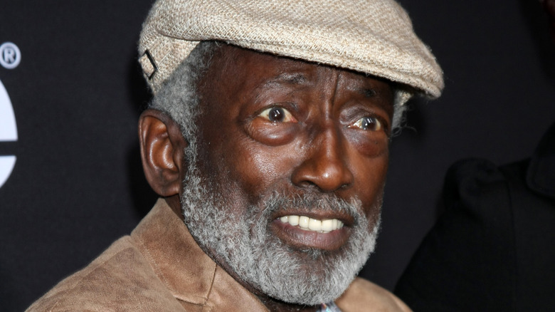 Garrett Morris in a flat cap