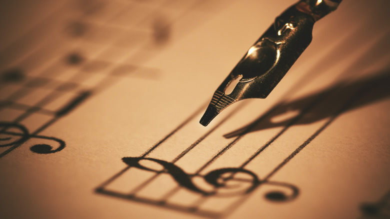 pen writing musical notes