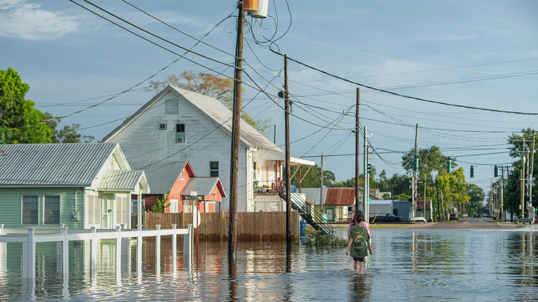 displaced person wading in water