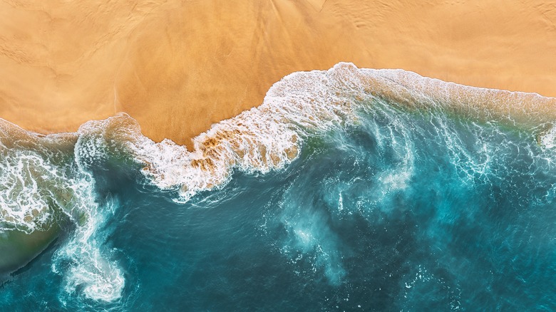 Photo of waves lapping on beach