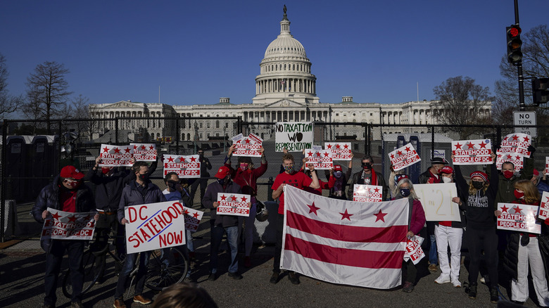 Campaigners stand before Capitol