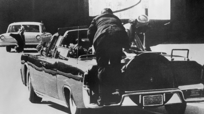 clint hill climbs onto presidential limo during JFK assassination