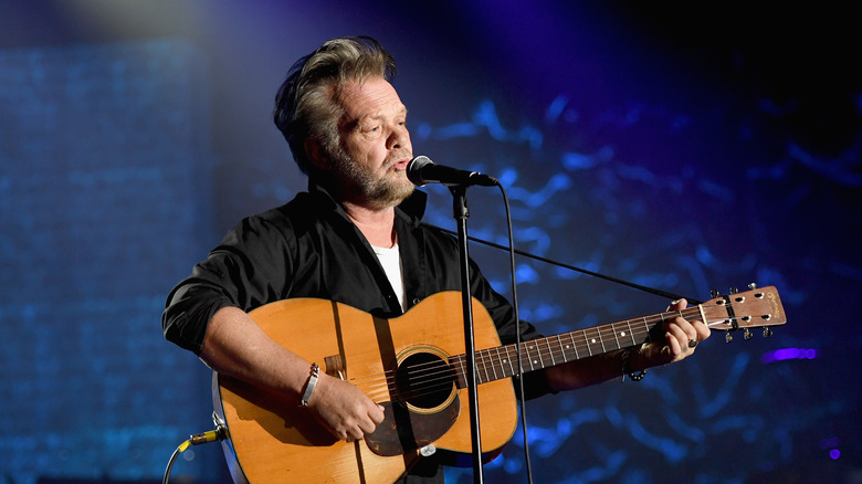 John Mellencamp playing guitar