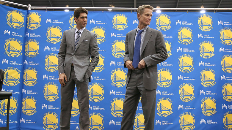 Bob Myers and Steve Kerr standing onstage