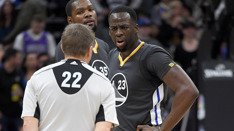 Kevin Durant and Draymond Green arguing with ref