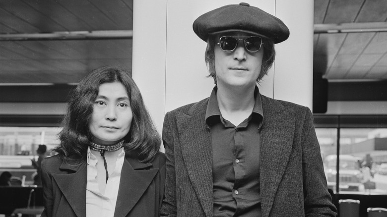 John Lennon and Yoko Ono posing