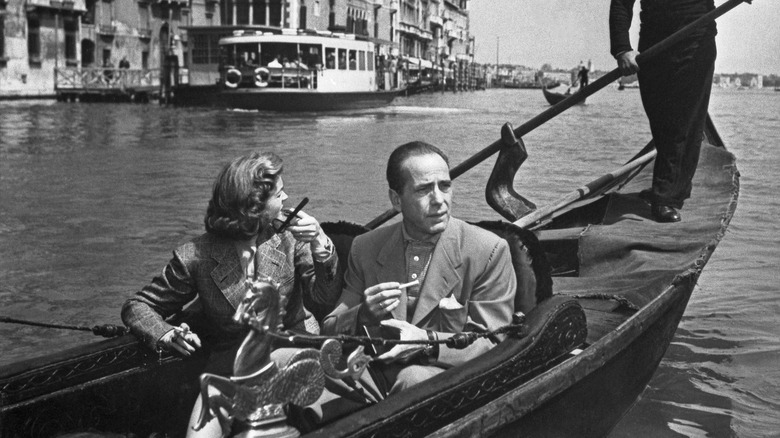 Lauren Bacall and Humphrey Bogart riding in a gondola