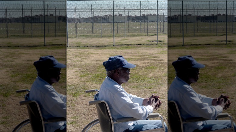 Prisoner looks out from wheelchair